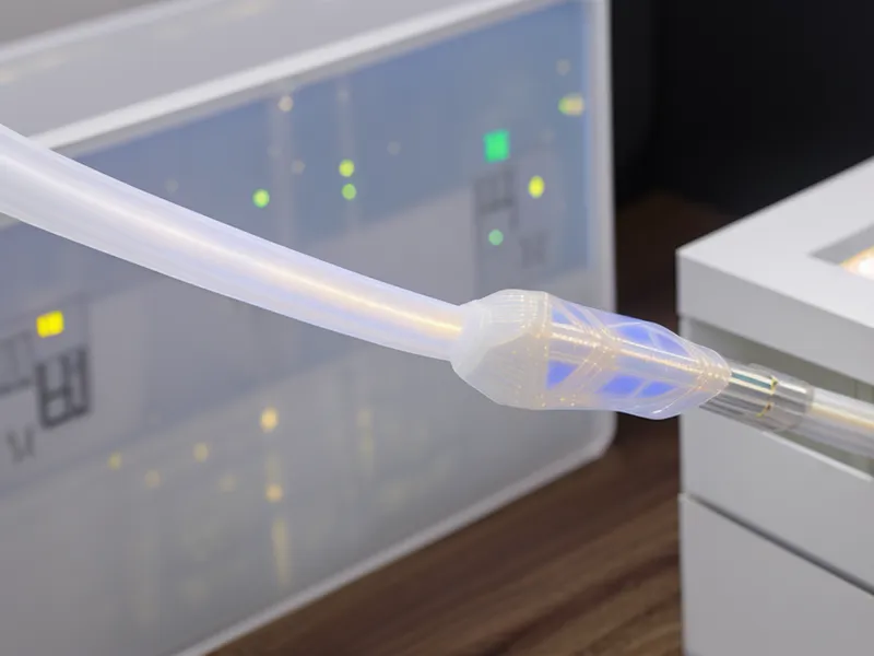 Close-up of a fiber optic cable being connected to an ONT box